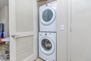 stacked washer and dryer in the laundry closet