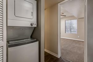 Stacked washer and dryer in an apartment hallway