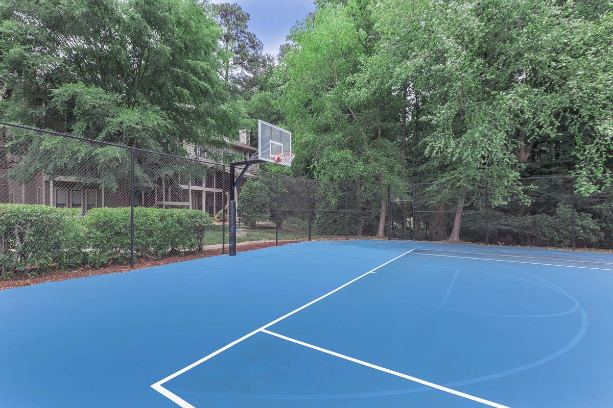 a basketball on a court with a racquet