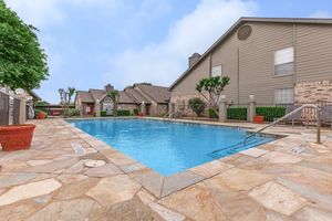 Plano Park community pool with green plants