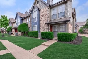 the community building with green shrubs
