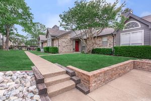 Plano Park community building with green grass