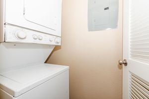 stacked washer and dryer in the laundry closet