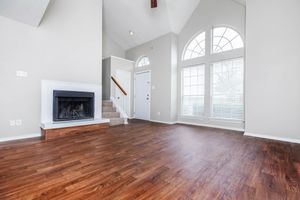 vacant living room with a fireplace