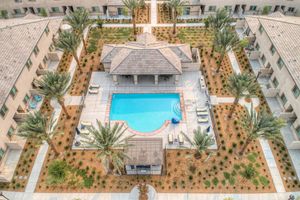 Masterpiece Parke community pool from above with green trees