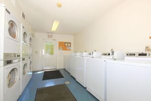 Laundry facility equipped with washers and dryers at Rainbow Ridge Apartments in Kansas City, Kansas