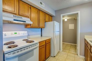 Kitchen with white appliances at Rainbow Ridge Apartments in Kansas City, Kansas