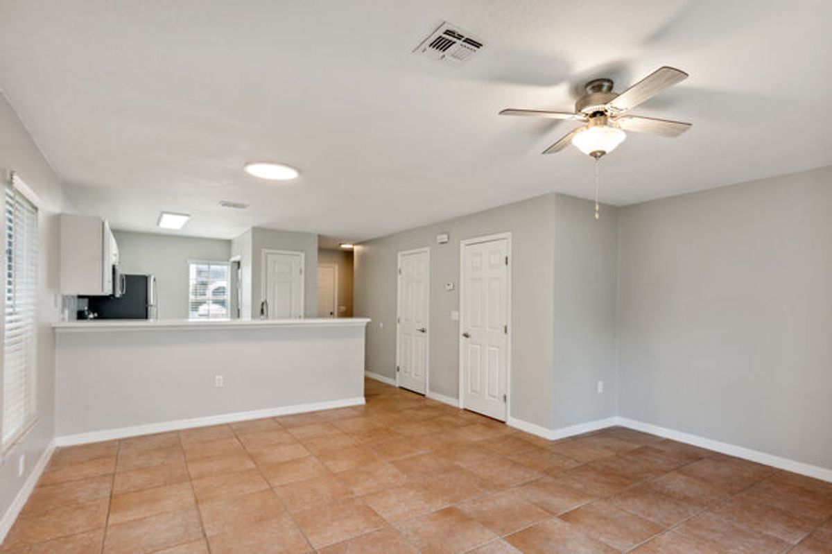 White Cabinets with Terracotta Tiled Floors