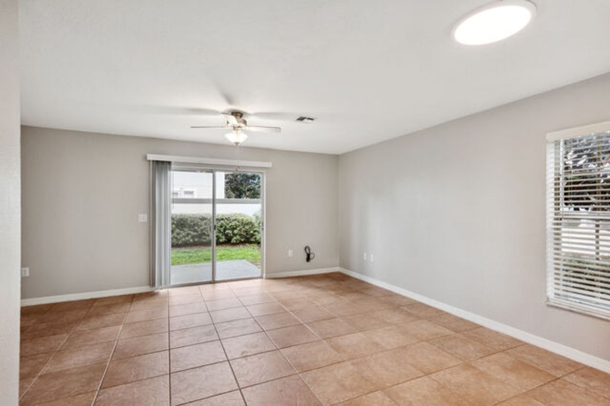 White Cabinets with Terracotta Tiled Floors