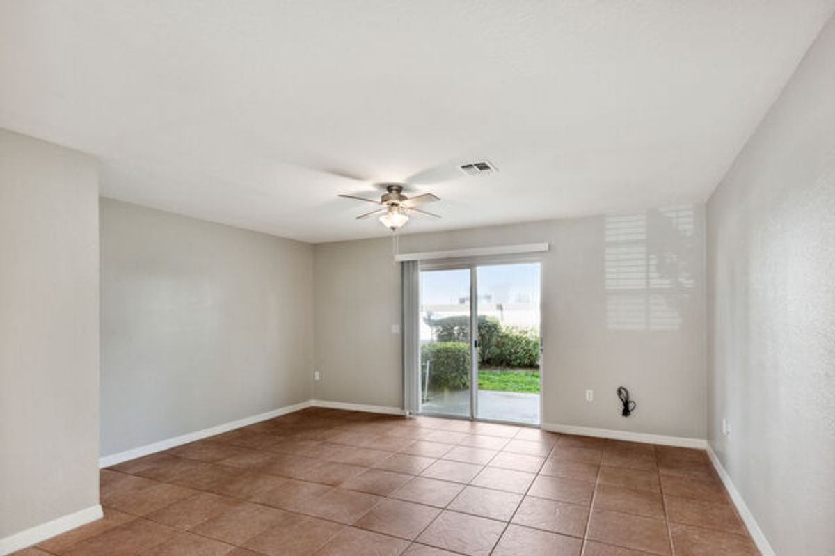 White Cabinets with Terracotta Tiled Floors