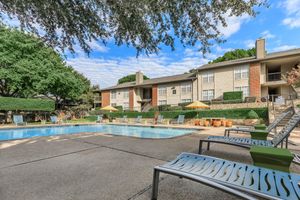 community pool with green trees