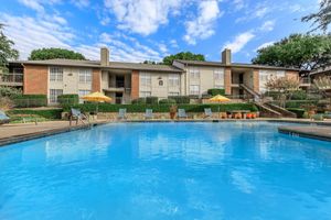 community pool with blue chairs