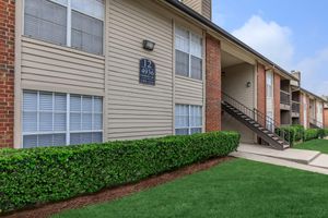 Oak Chase community building with green grass