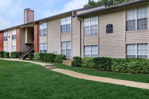 community building with green shrubs