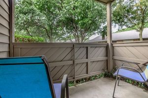 furnished patio with blue chairs