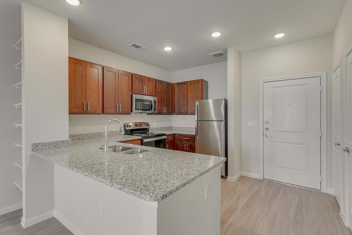 Pflugerville TX Senior Living- Legacy Ranch at Dessau East Spacious Kitchen with Plenty of Counterspace, Wooden Cabinetry, Energy Efficient Appliances, and Much More
