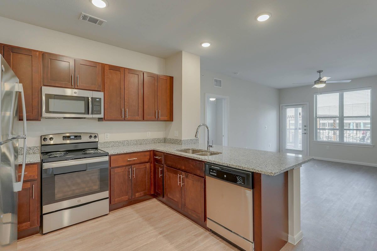 Pflugerville TX Senior Living- Legacy Ranch at Dessau East Spacious Kitchen with Plenty of Counterspace, Wooden Cabinetry, Energy Efficient Appliances, and Much More
