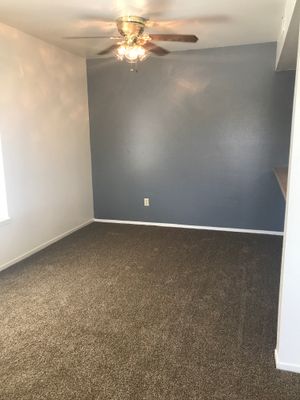 Carpeted bedroom with built-in shelves