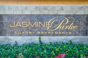 Jasmine Parke Apartments monument sign with green plants