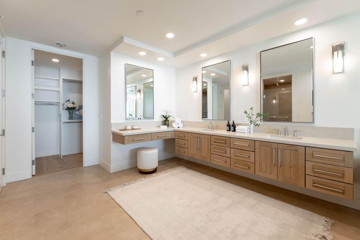 a large room with a sink and a mirror