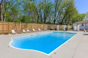 Plenty of mature landscaping and privacy fence by the pool.