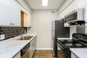 Well-lit kitchens at The Roosevelt Apartment Homes