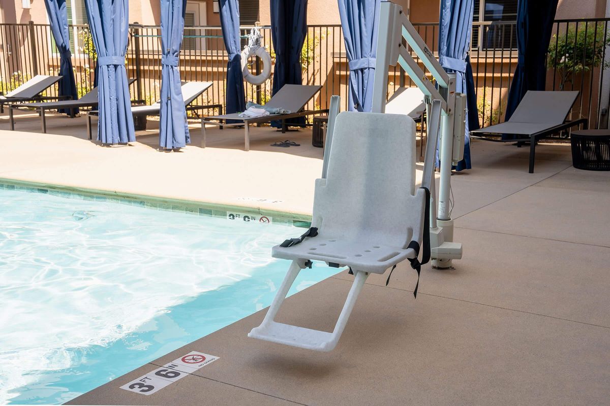 a chair sitting in front of a pool