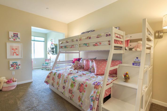 furnished carpeted bedroom with bunk beds