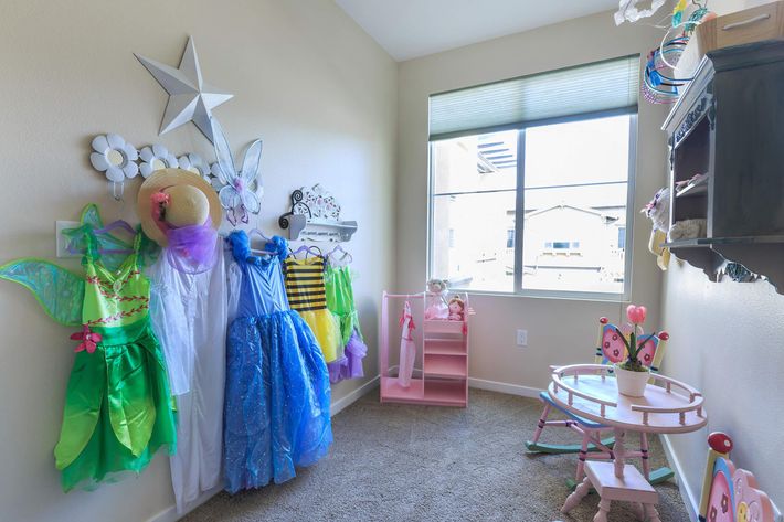 furnished kids room with costumes 