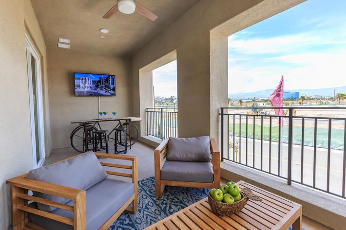 furnished patio with a TV
