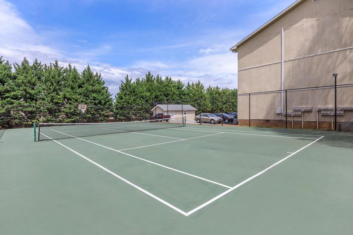 a building with a racket on a court