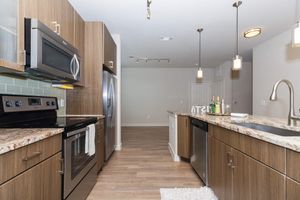 unfurnished kitchen with wooden cabinets