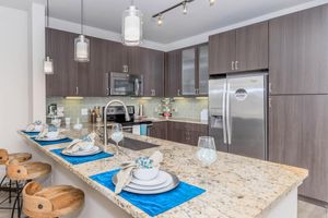 kitchen with tan granite countertops