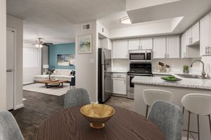 Diamond Living Room and Kitchen with Stainless Steel Appliances and Breakfast Bar