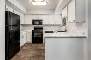 Ruby Kitchen with Black Appliances