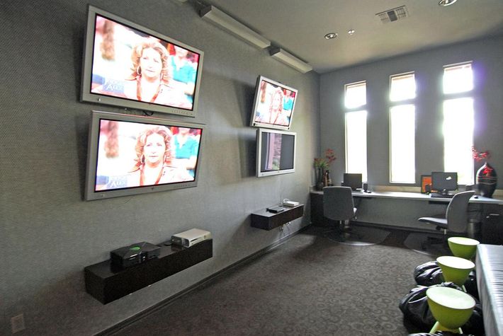 a room filled with furniture and a flat screen tv