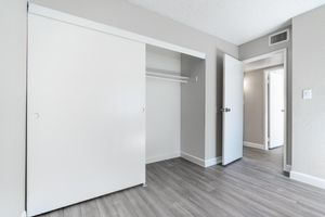 Large sliding door closet in bedroom