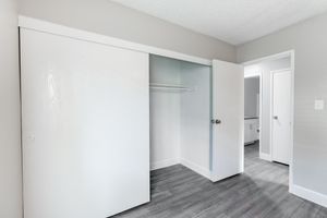 White sliding closet door and bedroom entry way