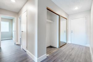 Apartment entryway with mirrored closets