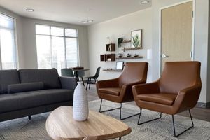 a living room with a leather chair