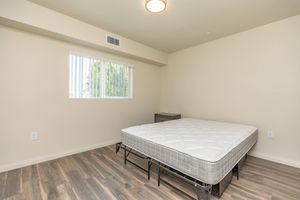 a bedroom with a bed in a room
