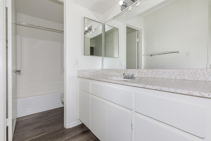 Bathroom sink with white cabinets