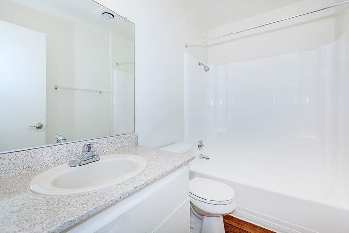 Bathroom with white cabinets