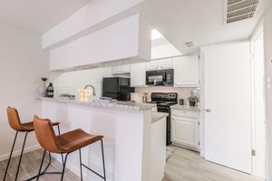 a kitchen with a table in a room