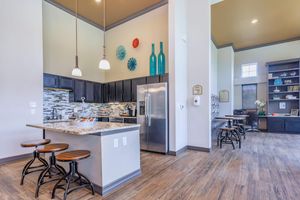 Paladin Apartments community kitchen with stainless steel appliances