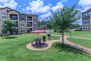 Paladin Apartments community area with a picnic table