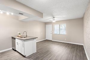 Spacious and open 1 bedroom floor plan with large window and kitchen island