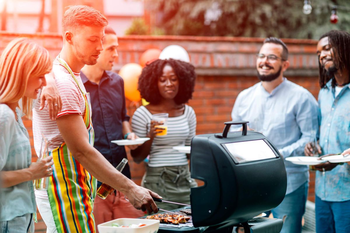 Barbecue with Friends at Bluff View at Northside Apartments 