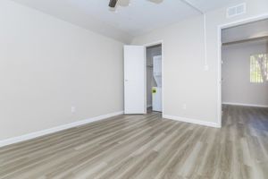 Large empty apartment floor plan with stacked washer and dryer in closet