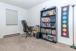 a living room with a book shelf